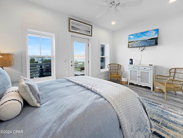 bedroom featuring wood-type flooring, ceiling fan, and access to exterior