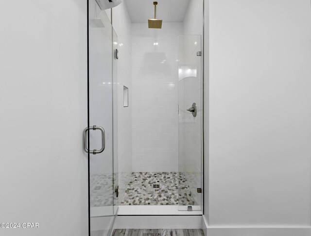 bathroom featuring a shower stall