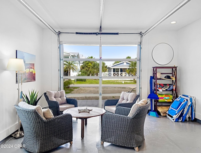 sitting room featuring concrete floors