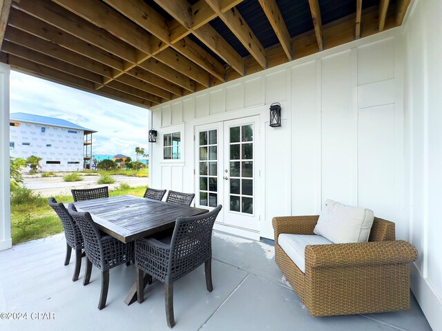 view of patio / terrace featuring outdoor dining space and french doors