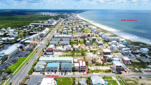 birds eye view of property with a beach view and a water view