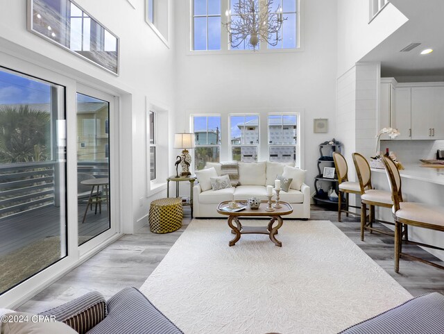 living room featuring visible vents and wood finished floors
