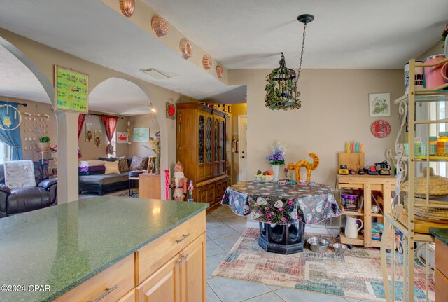 dining area featuring light tile patterned floors