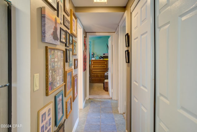 corridor featuring light tile patterned floors