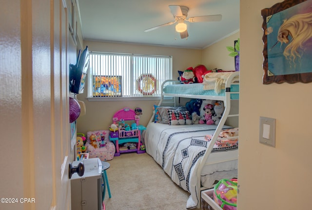 bedroom featuring crown molding, ceiling fan, and light carpet