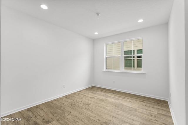 empty room with light wood-type flooring