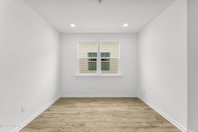 unfurnished room featuring light wood-type flooring