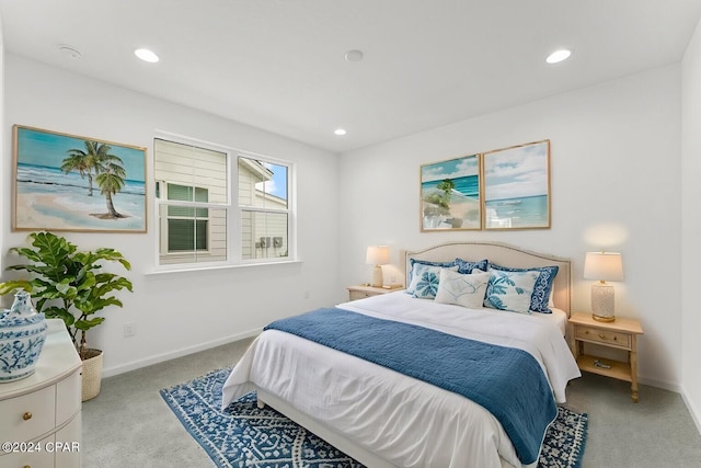 bedroom featuring light colored carpet