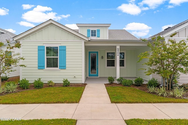 bungalow with a front yard