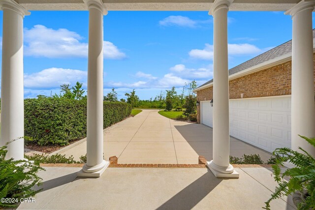 view of patio / terrace with a garage