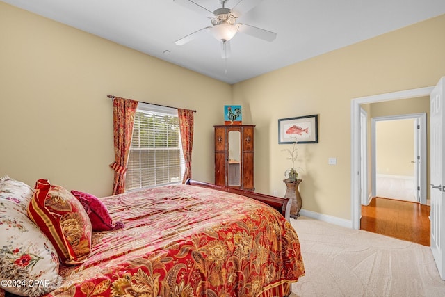 bedroom featuring ceiling fan and hardwood / wood-style flooring