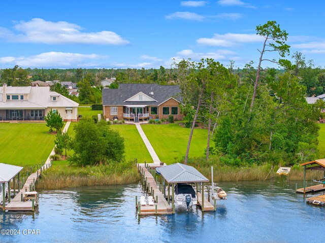 dock area featuring a yard and a water view