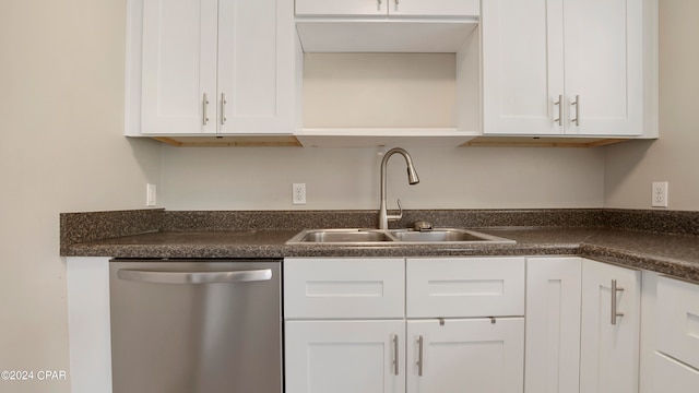 kitchen with dishwasher, sink, and white cabinets