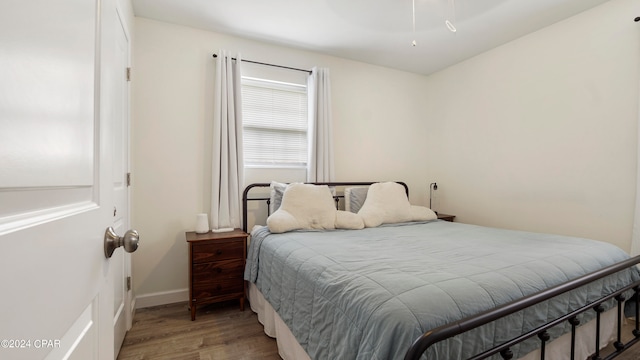 bedroom with wood-type flooring