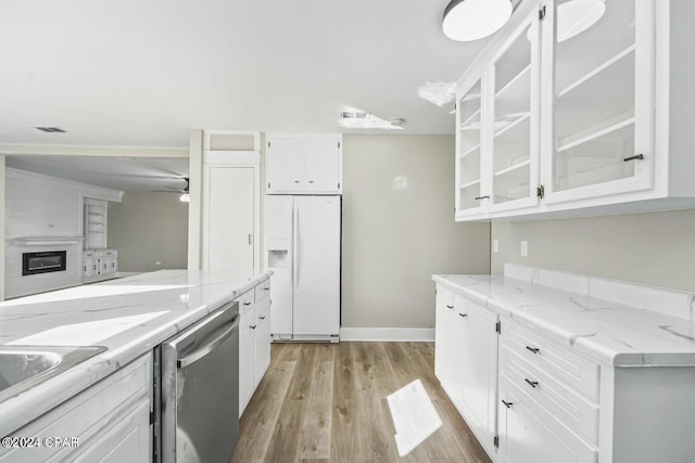 kitchen featuring white fridge with ice dispenser, white cabinets, dishwasher, and light hardwood / wood-style floors