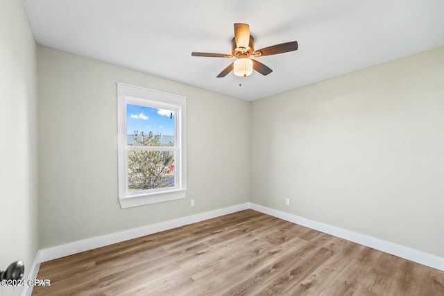 spare room featuring ceiling fan and light hardwood / wood-style flooring