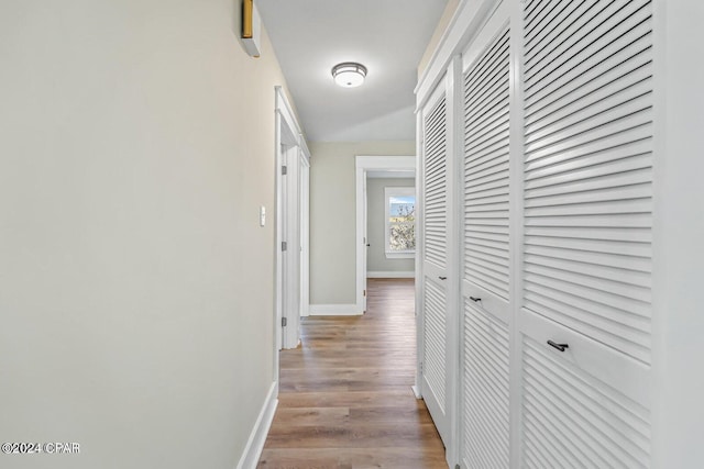 hallway with light wood-type flooring