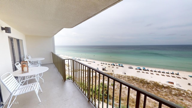 balcony with a view of the beach and a water view