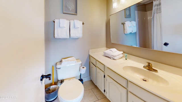 bathroom with vanity, toilet, a shower with shower curtain, and tile patterned flooring