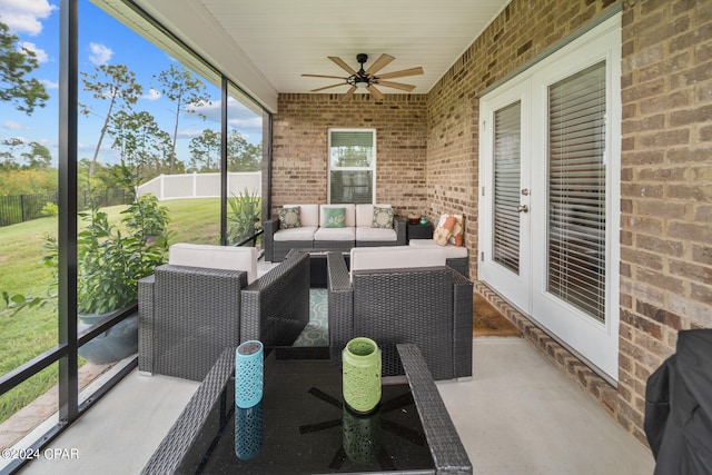 sunroom / solarium with ceiling fan