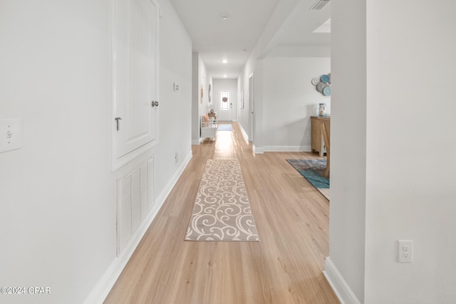 corridor featuring wood-type flooring