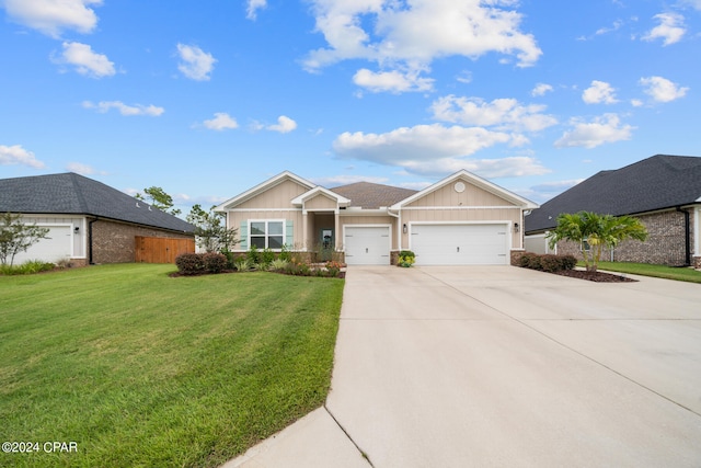 ranch-style house with a garage and a front lawn