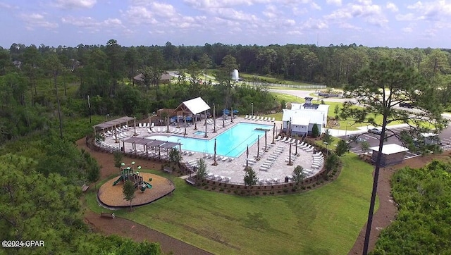 view of swimming pool with a patio and a lawn