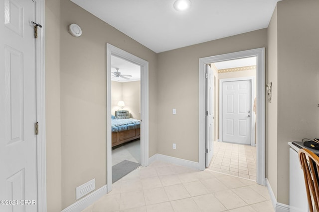 hallway with light tile patterned flooring