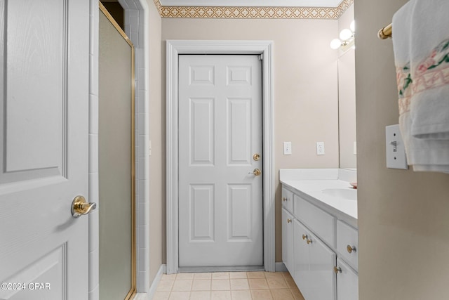 bathroom featuring vanity and a shower with shower door