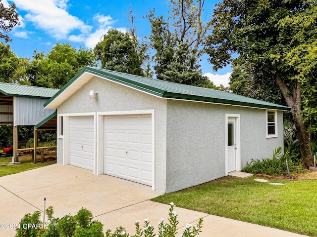 garage with a yard