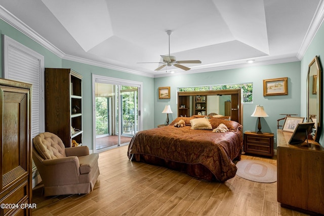 bedroom featuring light hardwood / wood-style flooring, access to exterior, and crown molding