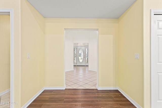 corridor featuring hardwood / wood-style flooring