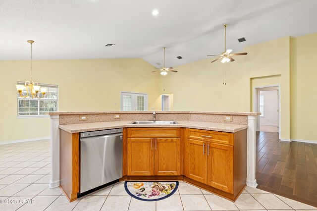 kitchen with an inviting chandelier, backsplash, stainless steel fridge, light hardwood / wood-style floors, and lofted ceiling