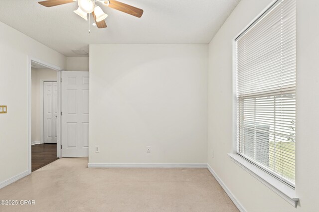 unfurnished bedroom with light carpet, a closet, and a textured ceiling