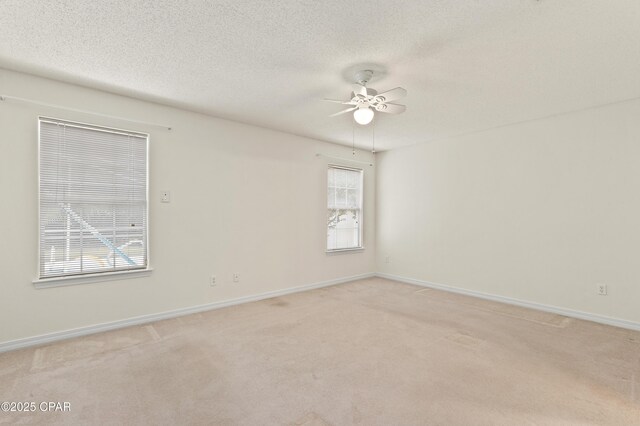 carpeted bedroom with ceiling fan and ensuite bathroom