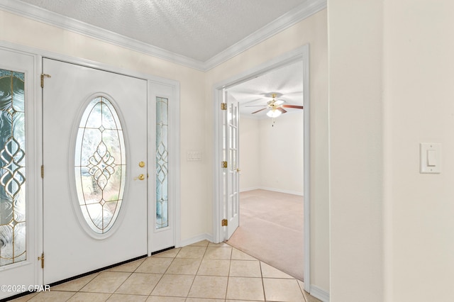 empty room with ceiling fan, ornamental molding, light carpet, and french doors