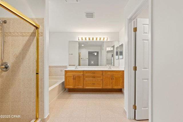 bathroom featuring tile patterned floors, vanity, and plus walk in shower