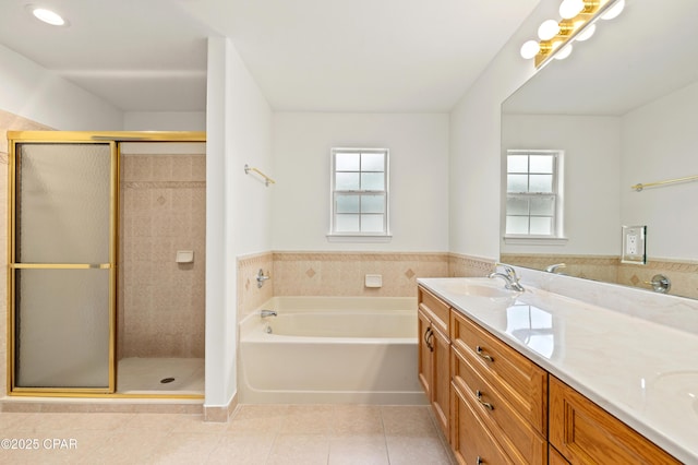 bathroom featuring tile patterned floors, plenty of natural light, vanity, and shower with separate bathtub