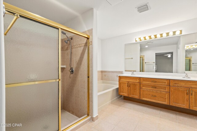 bathroom with tile patterned floors, plus walk in shower, and vanity