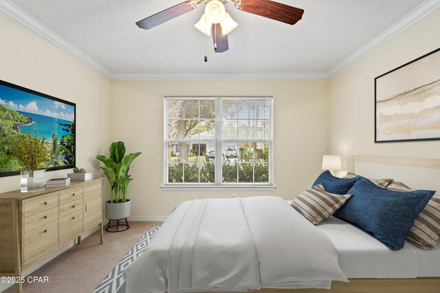 bedroom featuring ceiling fan, ornamental molding, and light carpet