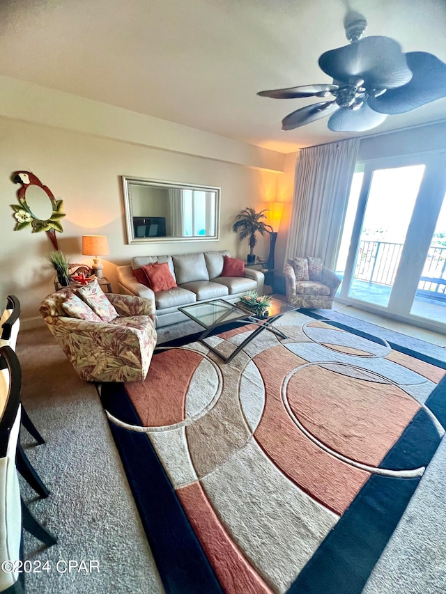 carpeted living room featuring ceiling fan