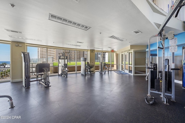 exercise room with a textured ceiling