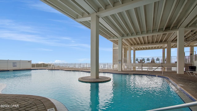 view of swimming pool featuring a patio area