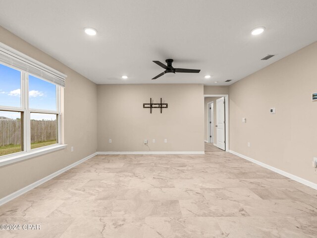 spare room with ceiling fan