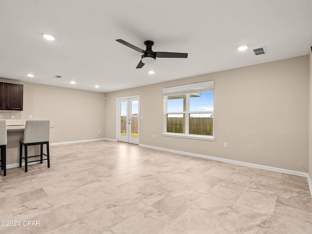 living room with french doors and ceiling fan