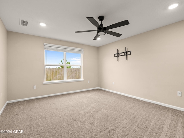 carpeted empty room with ceiling fan