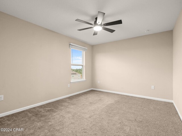 carpeted empty room with ceiling fan