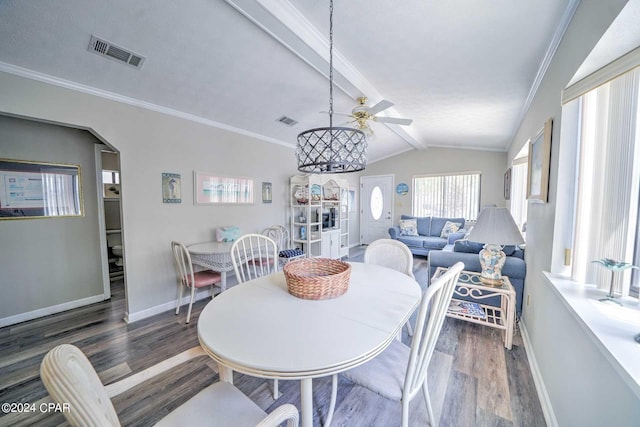 dining space featuring lofted ceiling with beams, ceiling fan, ornamental molding, and dark hardwood / wood-style flooring