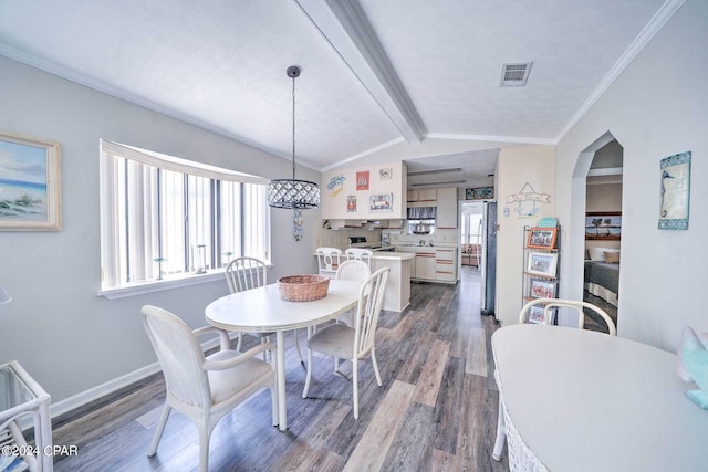 dining room with vaulted ceiling with beams, ornamental molding, sink, and dark wood-type flooring