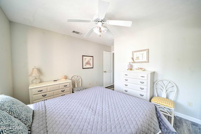 bedroom with ceiling fan and hardwood / wood-style flooring